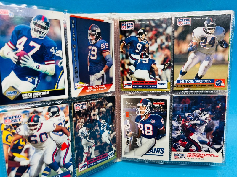 Photo 1 of 593395…  final sale no returns/refunds-96 mixed New York Giants cards in binder