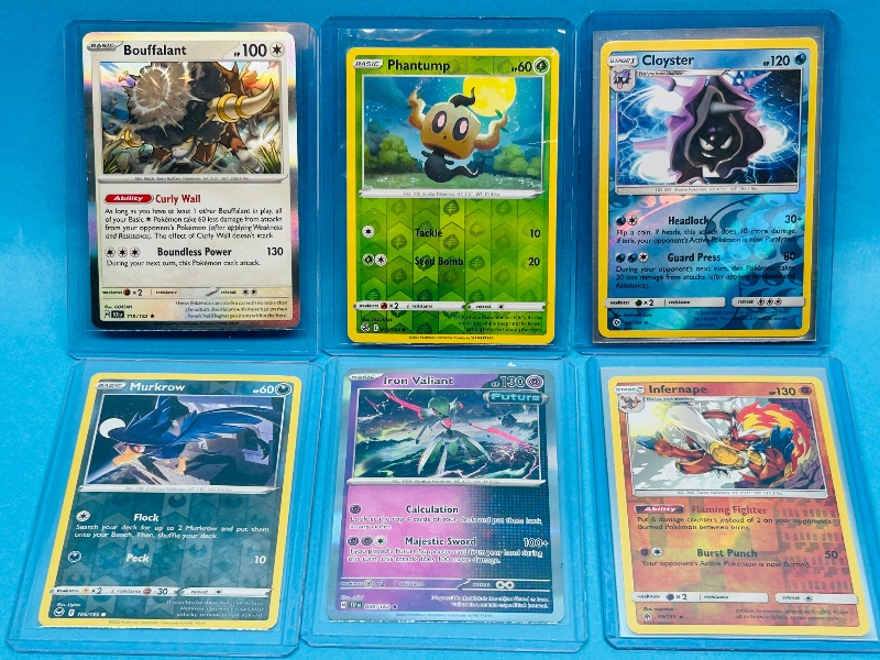 Photo 1 of 593430…6 reverse and holo Pokémon cards in hard plastic sleeves 
