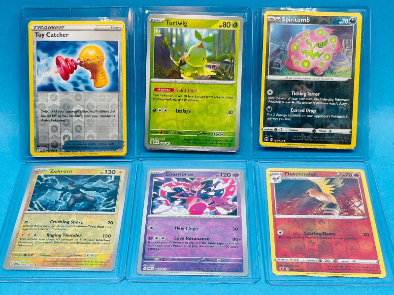 Photo 1 of 593432… 6 reverse and holo Pokémon cards in hard plastic sleeves 