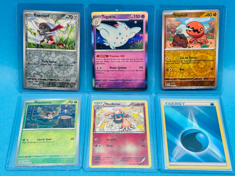 Photo 1 of 593433… 6 reverse and holo Pokémon cards in hard plastic sleeves 