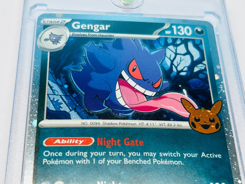Photo 1 of 593435…Holo Gengar trick or trade Pokémon card in hard plastic case