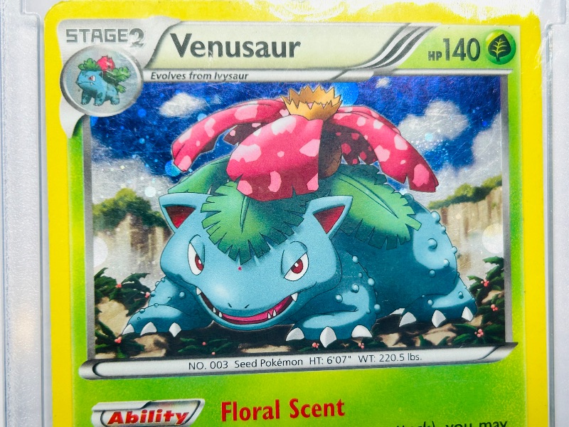 Photo 1 of 593437…holo Venusaur Pokémon card in hard plastic case