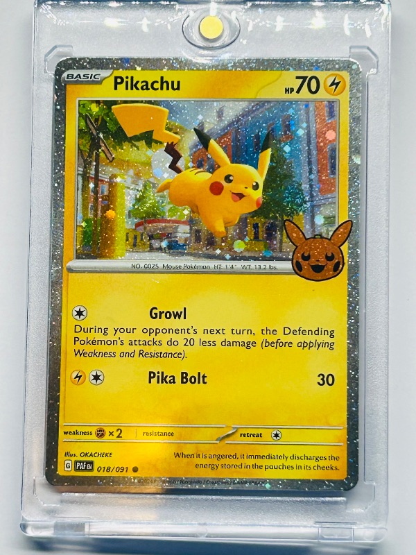 Photo 1 of 593438…Pikachu cosmos holo trick or trade Pokémon card in hard plastic case