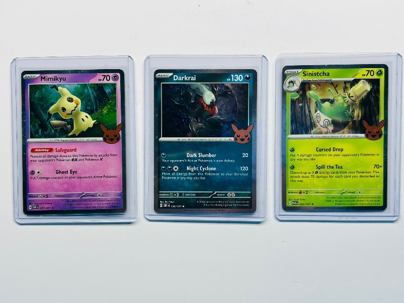 Photo 1 of 593441… 3 holo trick or trade Pokémon cards in hard plastic sleeves 