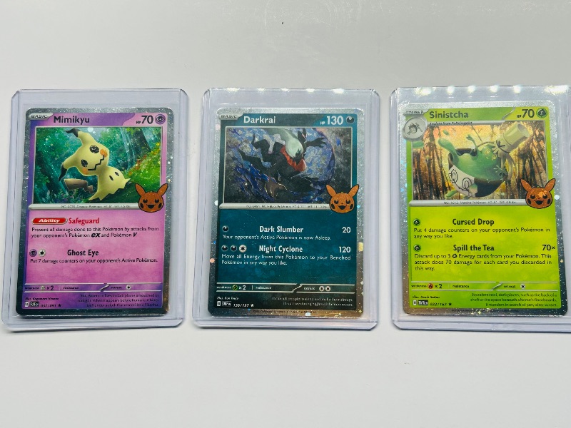 Photo 1 of 593441… 3 holo trick or trade Pokémon cards in hard plastic sleeves 
