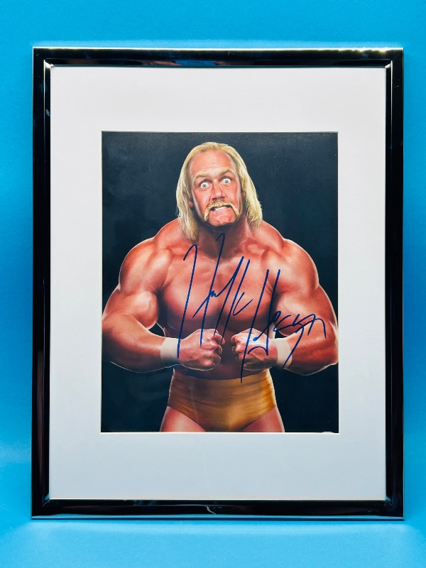Photo 1 of 593449…..autographed Hulk Hogan picture with certification sticker 14 x 12 “ approx