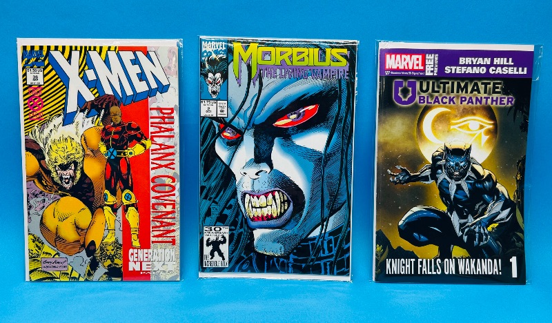 Photo 1 of 593494…3 comics in plastic sleeves 
