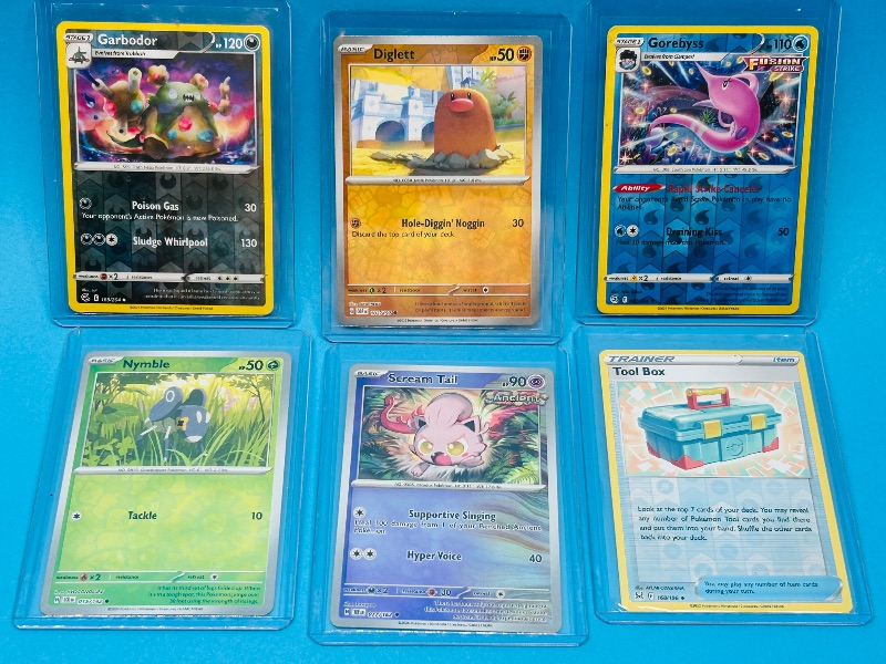 Photo 1 of 593570…6 reverse holo Pokémon card in hard plastic sleeves 