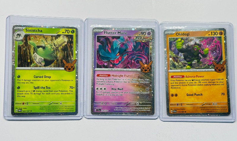 Photo 1 of 593574…3 Pokémon holo trick or trade cards in hard plastic sleeves 