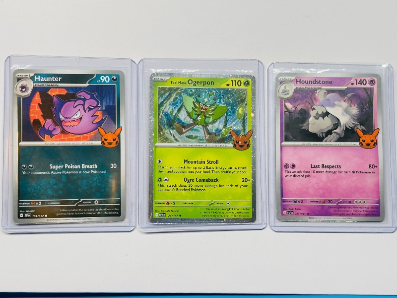 Photo 1 of 593575 …3 Pokémon trick or trade cards in hard plastic sleeves 