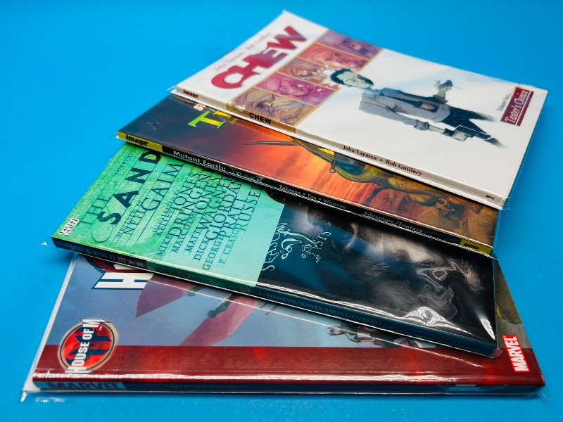 Photo 1 of 593884…4 soft cover comic books in plastic sleeves 