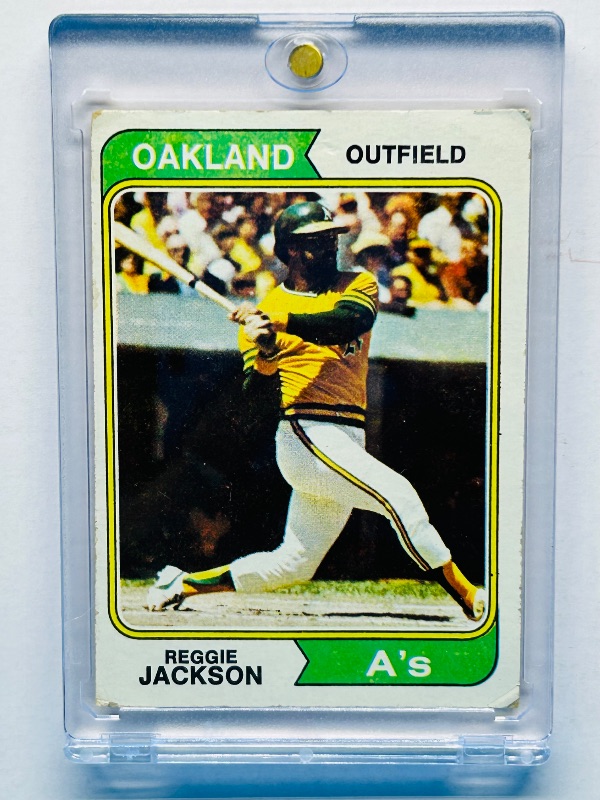 View 1 of 593989…Reggie Jackson card 130  in hard plastic case-wear from age