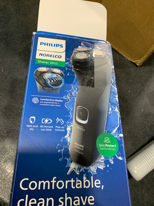 Photo 1 of Philips Norelco Shaver 2400 Series, Wet and Dry Electric Shaver, Pop-up Trimmer, P-Cap, Deep Black, Model X3001/90