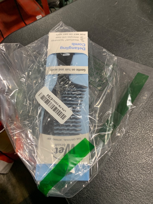 Photo 1 of Wet Brush Detangling Comb, Black - Wide Tooth Hair Detangler with WaveTooth Design that Gently and Glides Through Tangles - Brush Throough Conditioner and Hair Masks - Gentle On Scalp and Pain-Free
