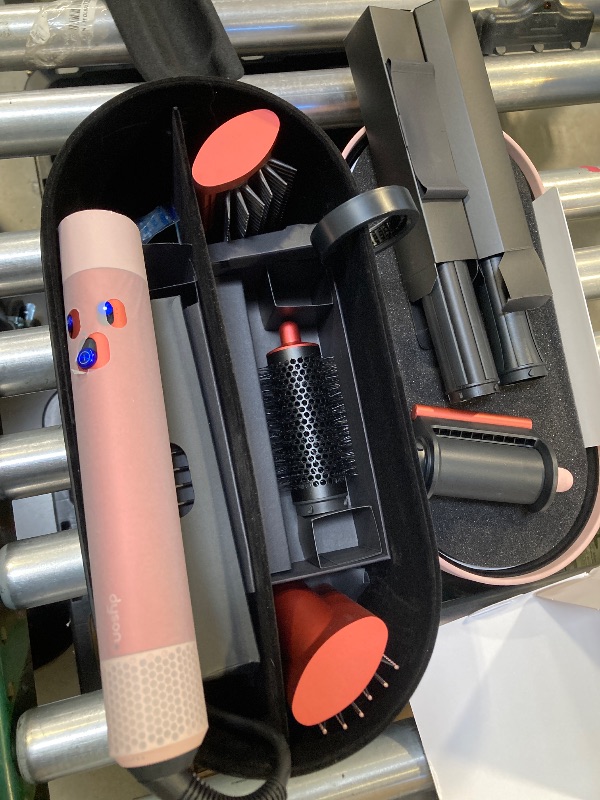 Photo 1 of Dyson Special edition Airwrap™ Complete long multi-styler in Strawberry bronze and blush pink with Detangling comb- VERY LIGHTLY USED
