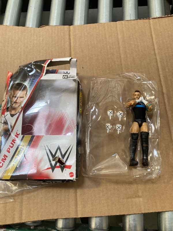 Photo 1 of Mattel WWE Top Picks Elite Action Figure & Accessories Set, CM Punk 6-inch Collectible with Swappable Hands, Ring Gear & 25 Articulation Points