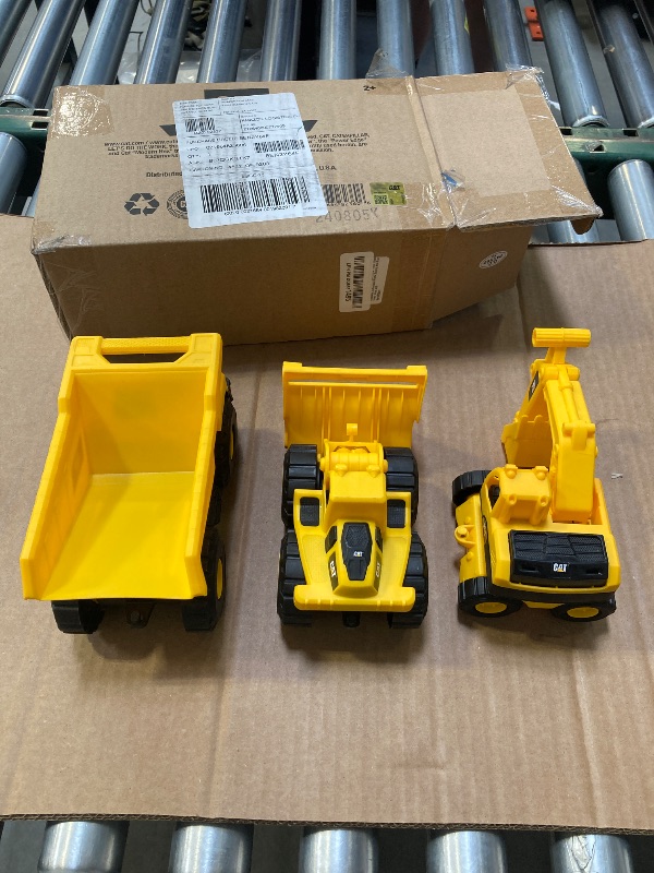 Photo 1 of CAT Construction Toys, Mini Crew 3-Pack 7”, Push-Powered Yellow Construction Vehicle Toys, Includes Dump Truck, Wheel Loader, and Excavator for Kids and Toddlers Ages 2+