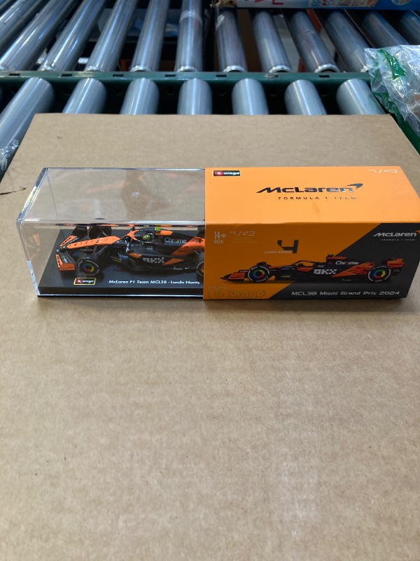 Photo 1 of Bburago 1:43 2024 Race McLaren MCL38 with Helmet, Norris #4