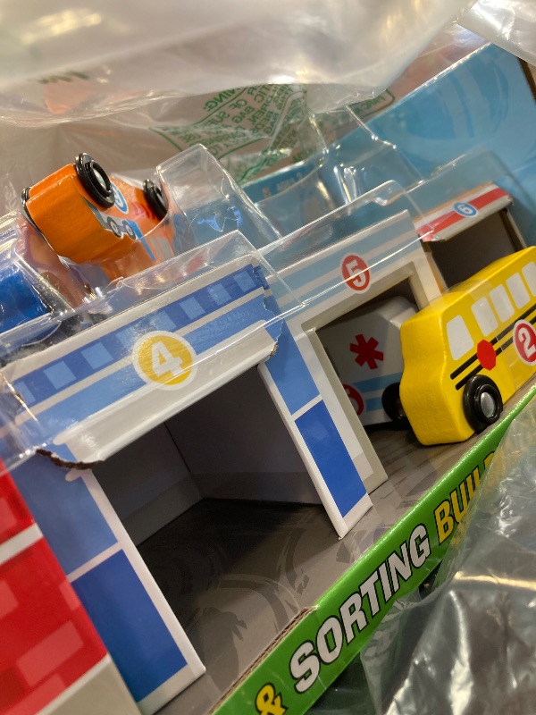 Photo 1 of Melissa & Doug Nesting and Sorting Blocks - 6 Buildings, 6 Wooden Vehicles - FSC Certified