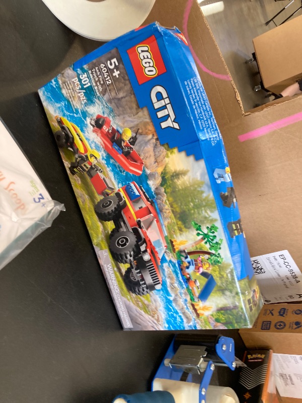 Photo 1 of LEGO City 4x4 Fire Truck with Rescue Boat Toy for Kids Ages 5 and Up, Pretend Play Toy for Boys and Girls with a Truck Toy, Trailer, Dinghy and Tent, Plus 1 Camper and 2 Firefighter Minifigures, 60412