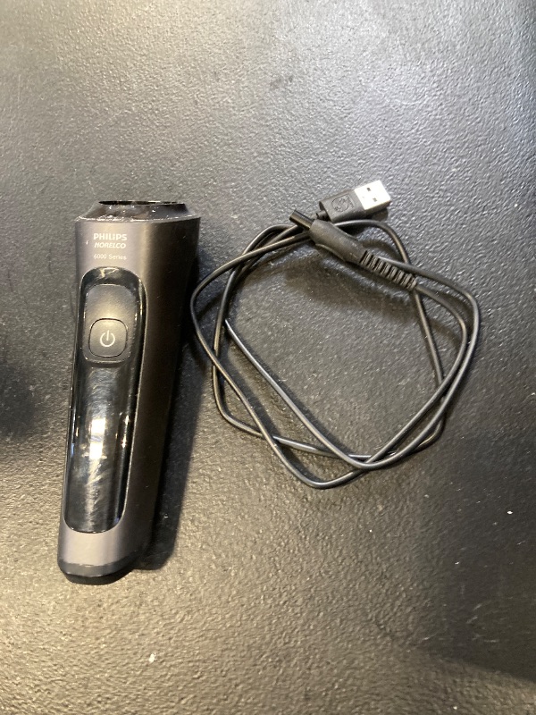Photo 1 of Philips Norelco Shaver 2400 Series, Wet and Dry Electric Shaver, Pop-up Trimmer, P-Cap, Deep Black, Model X3001/90
