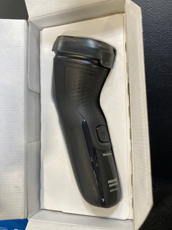 Photo 1 of Philips Norelco Shaver 2400 Series, Wet and Dry Electric Shaver, Pop-up Trimmer, P-Cap, Deep Black, Model X3001/90