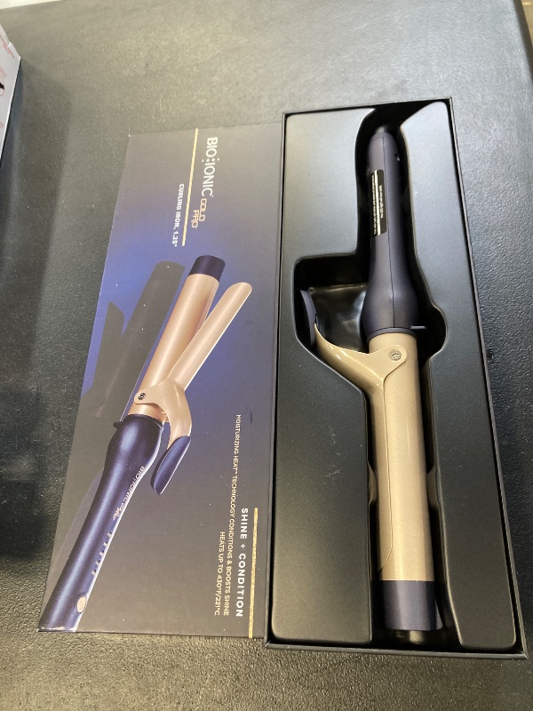 Photo 1 of Bio Ionic GoldPro 1.25" Curling Iron, Blue, Moisturising Heat & 24K Gold MX, New & Improved 12% Longer Barrel Ceramic Curling Iron, Adjustable Heat, Versatile Hair Styling Wand for Long-Lasting Curls
