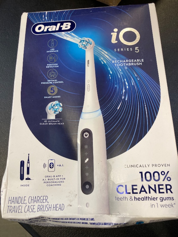 Photo 1 of Oral-B iO Series 5 Rechargeable Electric Toothbrush with Visible Pressure Sensor to Protect Gums, 2 Minute Timer, 5 Cleaning Settings, 1 Replacement Toothbrush Heads, and Travel Case, White