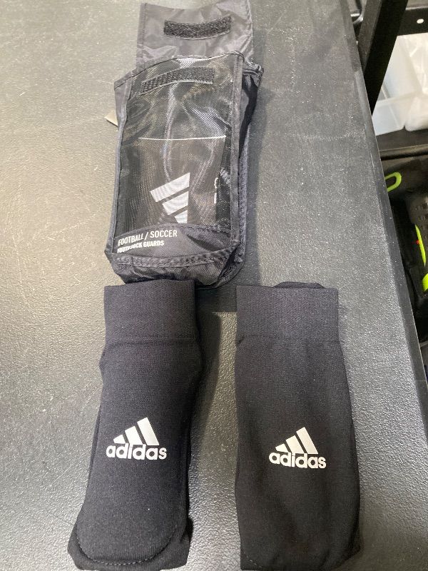 Photo 1 of adidas Unisex-Child Performance Youth Sock Shin Guards, Black/White, Medium