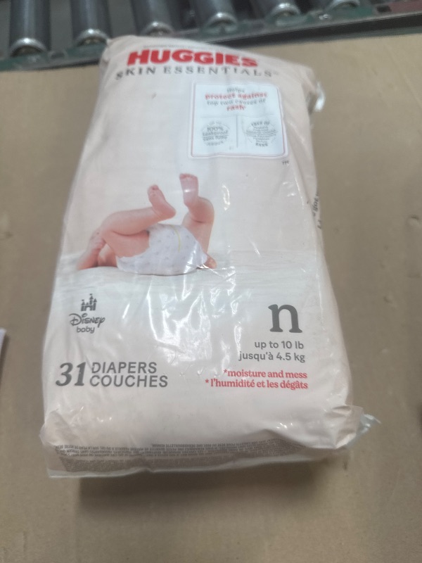 Photo 1 of Huggies Size Newborn Diapers, Skin Essentials Baby Diapers, Size Newborn (6-9 lbs), 31 Count, Packaging May Vary