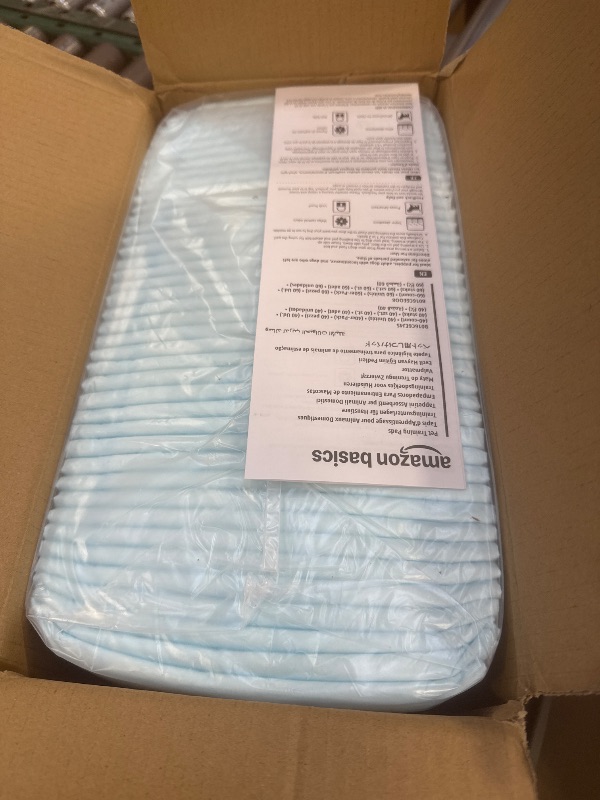 Photo 1 of Amazon Basics Puppy Pads with Quick-Dry 5-Layer Leak-Proof Design for Potty Training, X-Large Size 28 x 34 Inch, Pack of 40, Blue & White