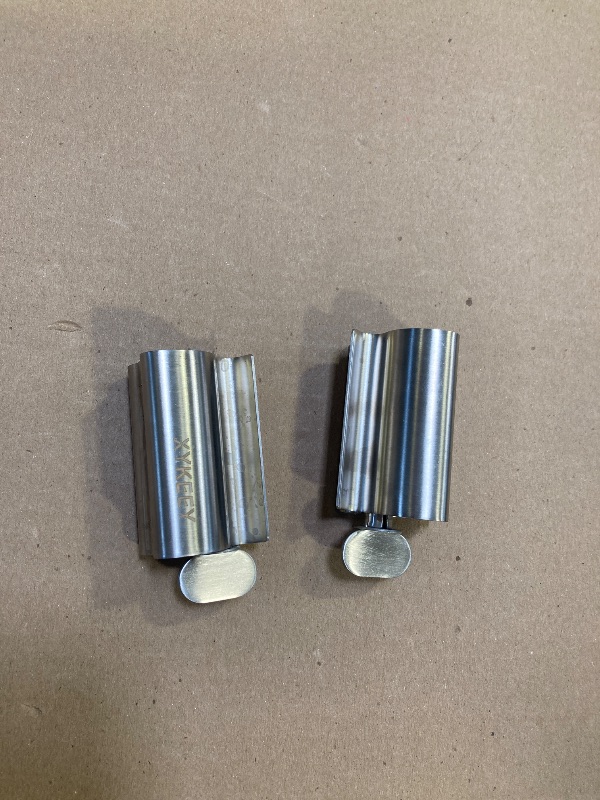 Photo 1 of XYKEEY Set of 2 Toothpaste Squeezer Rollers, Metal Toothpaste Tube Wringer Seat Holder Stand (Stainless Steel)