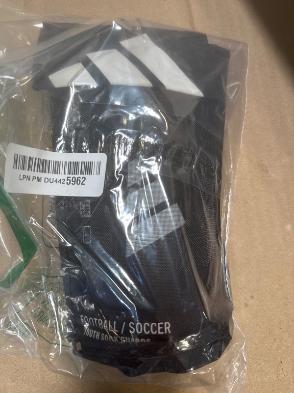 Photo 1 of adidas Unisex-Child Performance Youth Sock Shin Guards, Black/White, Medium