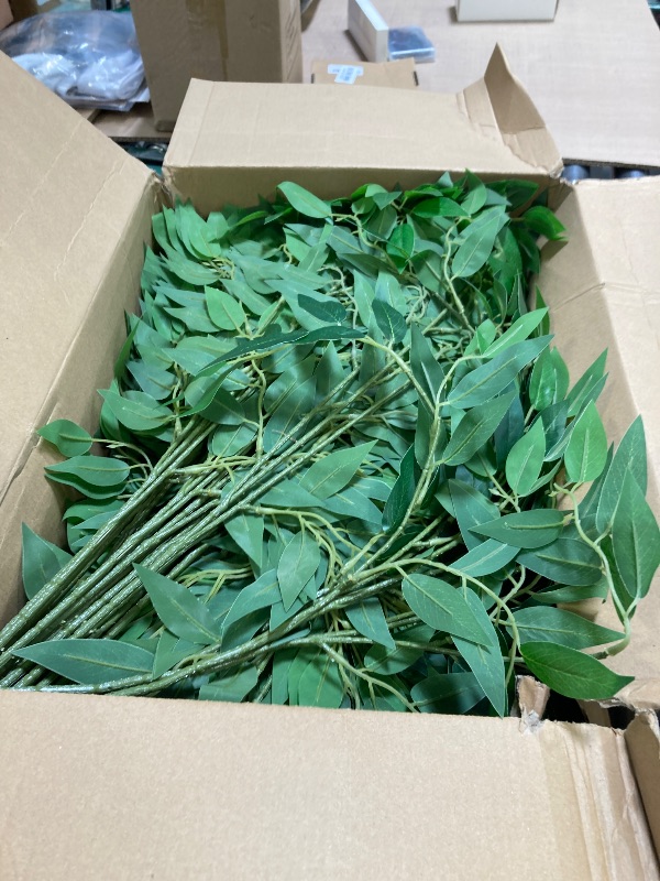Photo 1 of Xinnun 50 Pcs Artificial Italian Ruscus Greenery Stems 26.8 Inch Hanging Spray Fake Greenery for Centerpieces Faux Leaves Swag for Floral Arrangement Wedding Bouquet Garland Arch Home Decor