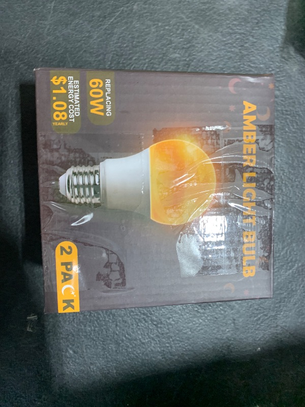 Photo 1 of DALUXshop Amber Sleep Light Bulbs, Blue Light Blocking, A19 9W(60 Watt Equivalent) Dim Light Bulbs for Lamp, 1800K Warm Light Bulb, E26 for Healthy Sleep, Bedroom, Kids Room, 2 Pack