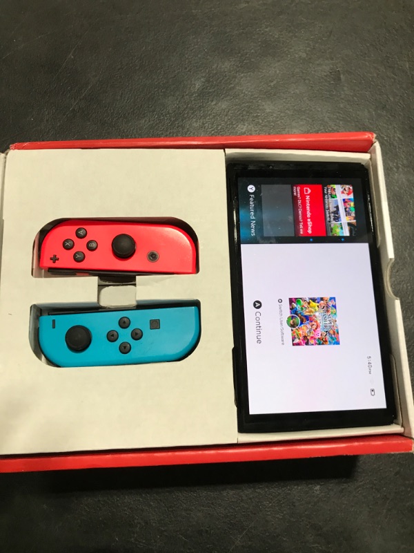 Photo 1 of Nintendo Switch – OLED Model w/ Neon Red & Neon Blue Joy-Con