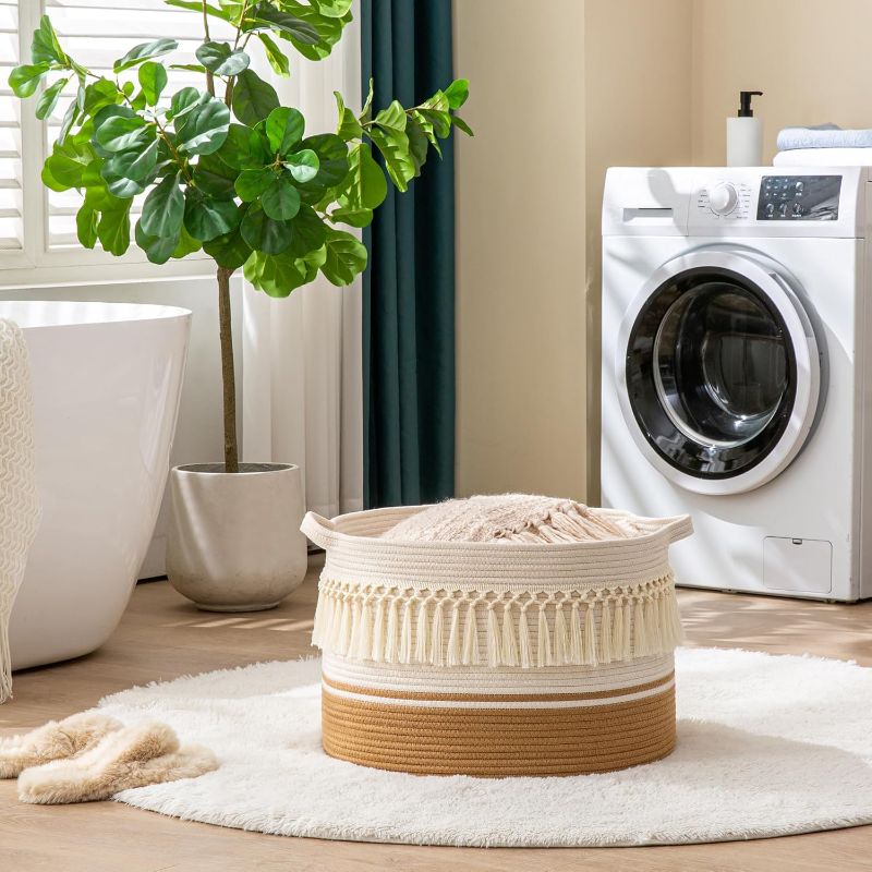 Photo 1 of KAKAMAY Large Blanket Basket (20"x13"),Woven Baskets for storage Baby Laundry Hamper, Cotton Rope Blanket Basket for Living Room, Laundry, Nursery, Pillows, Baby Toy chest (Brown Fringe)