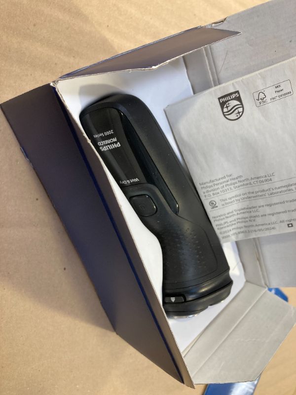 Photo 1 of Philips Norelco Shaver 2400 Series, Wet and Dry Electric Shaver, Pop-up Trimmer, P-Cap, Deep Black, Model X3001/90