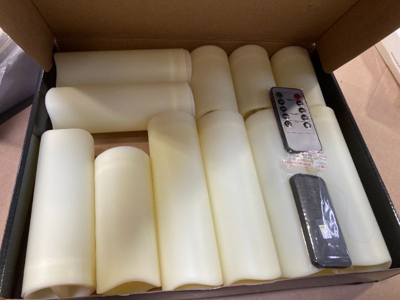 Photo 1 of Metaku Flameless Flickering LED Candles Set of 12 - Battery Operated Ivory with Remote & Timer for Halloween, Christmas, Bedroom, Home, Wedding, Birthday Decoration D2.2'' x H4''5''6''7''