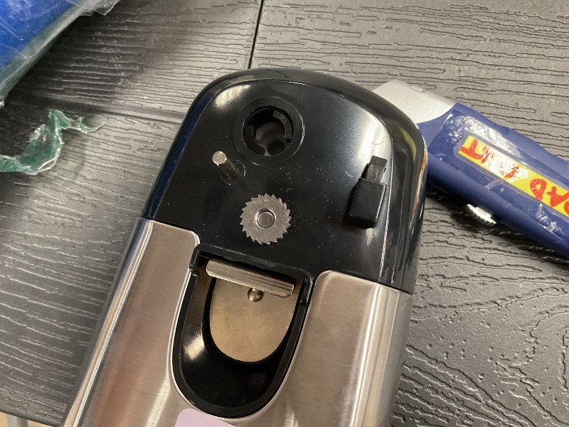 Photo 1 of See photo……Amazon Basics 3-In-1 Electric Can Opener, Bottle Opener and Knife Sharpener, with Stainless Steel Blade, Magnetic Lid Holder, Automatic, Countertop, 50W, Black