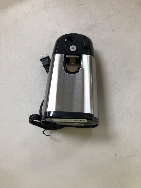 Photo 1 of See photo……Amazon Basics 3-In-1 Electric Can Opener, Bottle Opener and Knife Sharpener, with Stainless Steel Blade, Magnetic Lid Holder, Automatic, Countertop, 50W, Black
