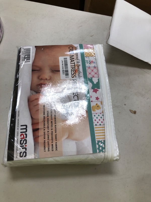 Photo 1 of Masirs Crib Mattress Protector Cover - Comfortable, Breathable and Waterproof Material. Keep The Crib Mattress Clean and Protected and Give Your Baby a Cozy Restful Sleep. Machine and Dryer Friendly.