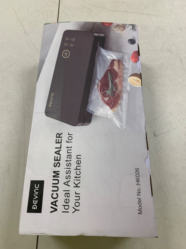 Photo 1 of DEVINC Vacuum Sealer Machine, Compact Food Sealer with 10 Vaccum Bags & 1 Bag Roll, Multi-functional Food Vacuum Sealer for Food Storage, Dry & Moist Food Modes with Built-in Cutter, Black