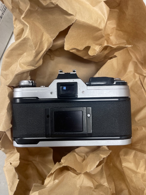 Photo 1 of FOR PARTS ONLY Canon AE-1 35mm Film Camera w/ 50mm 1:1.8 Lens (Renewed)