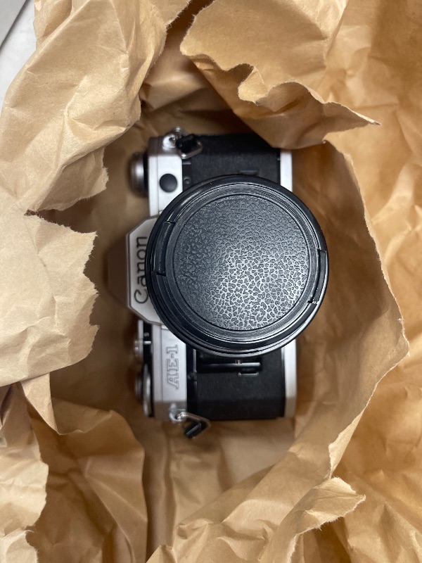 Photo 1 of FOR PARTS ONLY Canon AE-1 35mm Film Camera w/ 50mm 1:1.8 Lens (Renewed)