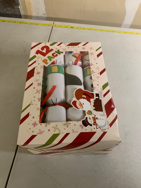 Photo 1 of 12 Pack Christmas Party Table Favors for Kids & Adults, Holiday Xmas Party Favors Holiday Dinner Table Gifts with Hats, Jokes & Surprise Toys, Christmas Party Supplies for Family Office Classroom