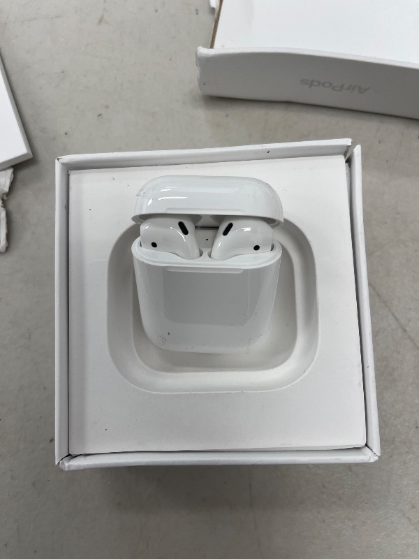 Photo 1 of Apple AirPods Wireless Ear Buds, Bluetooth Headphones with Lightning Charging Case Included, Over 24 Hours of Battery Life, Effortless Setup for iPhone