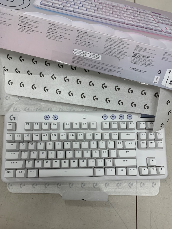 Photo 1 of Logitech G713 Wired Mechanical Gaming Keyboard with LIGHTSYNC RGB Lighting, Tactile Switches (GX Brown), and Keyboard Palm Rest, PC and Mac Compatible - White Mist