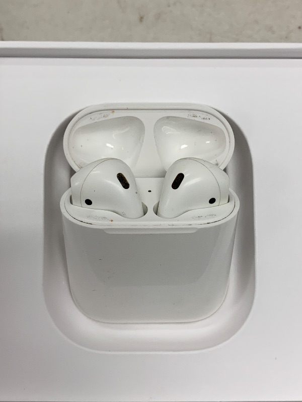 Photo 1 of Apple AirPods Wireless Ear Buds, Bluetooth Headphones with Lightning Charging Case Included, Over 24 Hours of Battery Life, Effortless Setup for iPhone