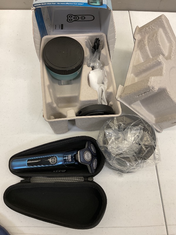 Photo 1 of Philips Norelco Shaver 7800, Rechargeable Wet & Dry Electric Shaver with SenseIQ Technology, Quick Clean Pod, Charging Stand, Travel Case and Pop-up Trimmer, S7885/85